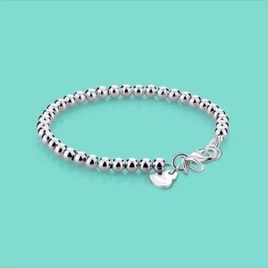 Sterling silver ball bracelet with charm